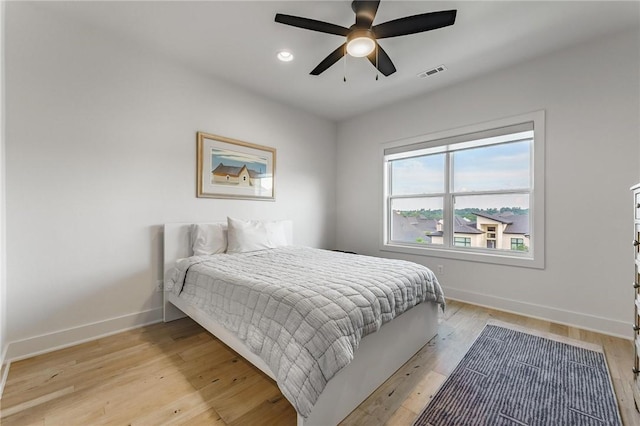 8003 W Claverton St, Rogers, AR 72758 - bedroom with light wood-style floors, ceiling fan, and recessed lighting