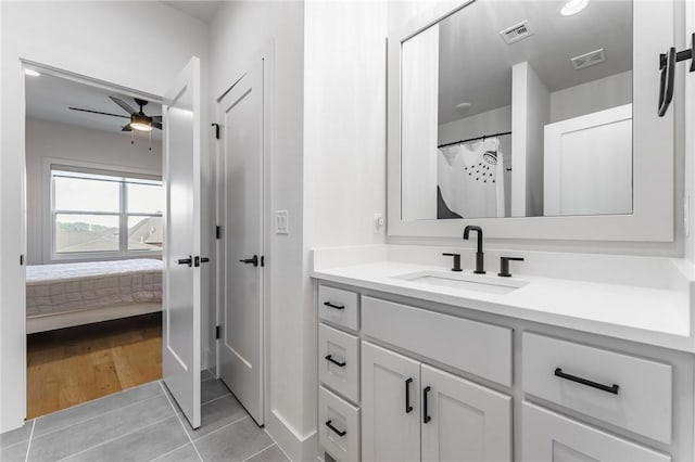 8003 W Claverton St, Rogers, AR 72758 - ensuite bathroom featuring vanity, a ceiling fan, and tile patterned flooring