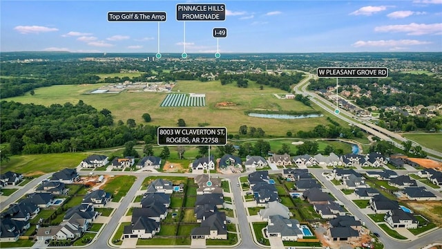 8003 W Claverton St, Rogers, AR 72758 - aerial view of property and surrounding area featuring a nearby body of water and nearby suburban area