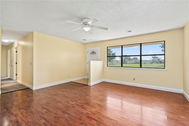 50233 S 725th Rd, Colcord, OK 74338 - spare room with wood finished floors, ceiling fan, and a textured ceiling