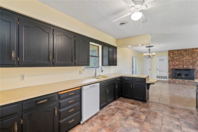 50233 S 725th Rd, Colcord, OK 74338 - kitchen with dishwasher, ceiling fan, a peninsula, a textured ceiling, and light countertops