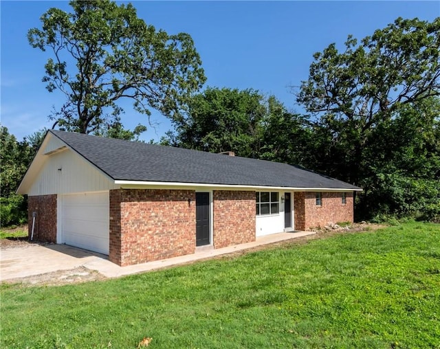 50233 S 725th Rd, Colcord, OK 74338 - view of property exterior featuring an attached garage, a yard, concrete driveway, and brick siding