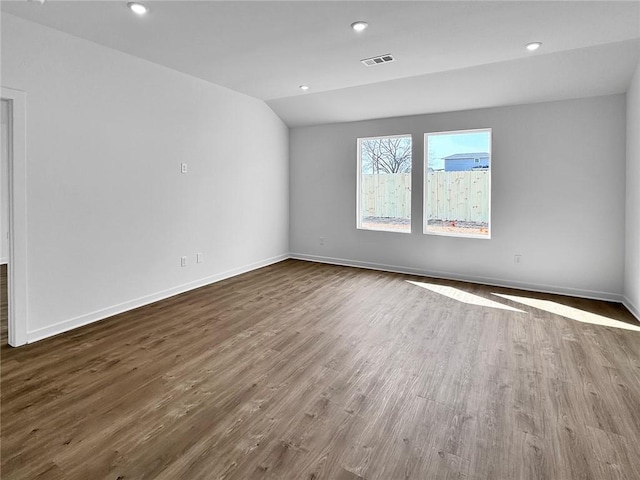 960 Hudson St, Prairie Grove, AR 72753 - unfurnished room featuring dark wood-type flooring, lofted ceiling, and recessed lighting