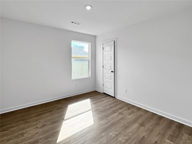 960 Hudson St, Prairie Grove, AR 72753 - spare room with dark wood-style flooring