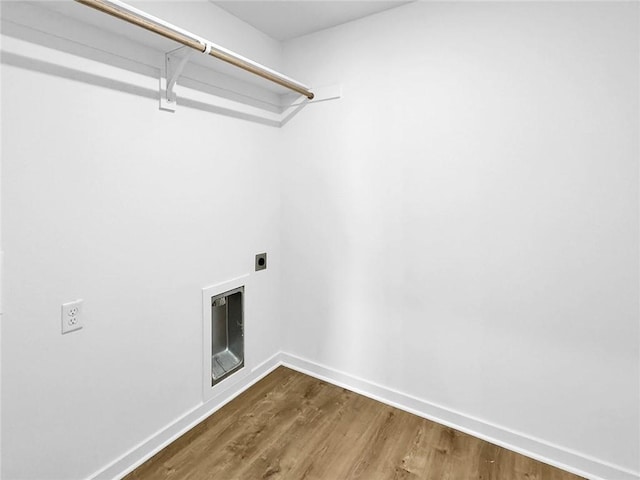 960 Hudson St, Prairie Grove, AR 72753 - washroom featuring hookup for an electric dryer, wood finished floors, and heating unit