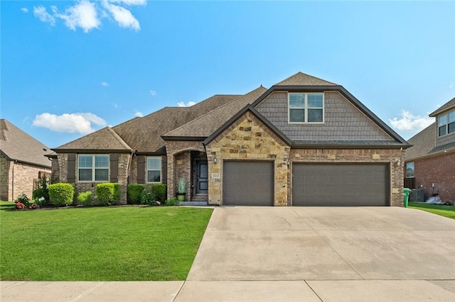 1511 Aniston Rd, Centerton, AR 72719 - view of front facade with concrete driveway, a front yard, brick siding, and an attached garage