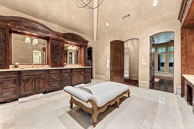 31 W Champions Blvd, Rogers, AR 72758 - full bathroom featuring double vanity and a high ceiling