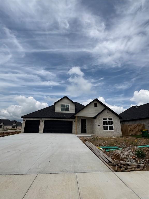 1309 Carrara, Tontitown, AR 72762 - view of front of home with driveway and a garage