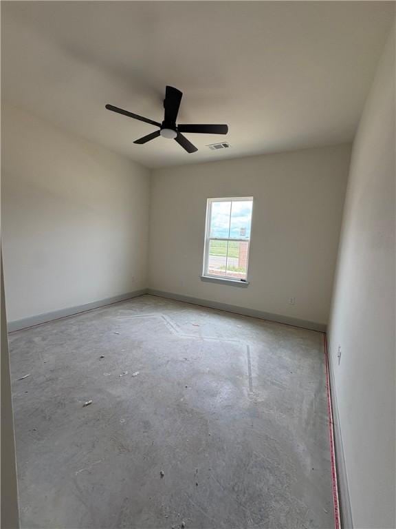 1309 Carrara, Tontitown, AR 72762 - spare room featuring unfinished concrete flooring and a ceiling fan