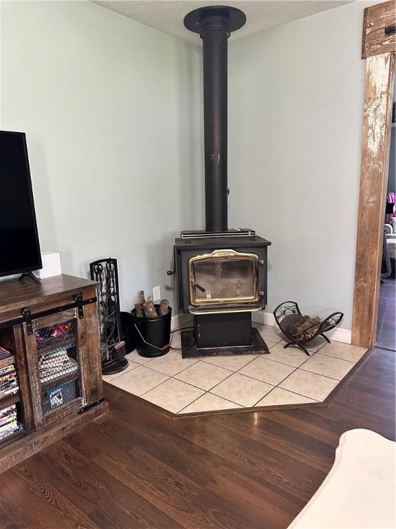 20796 Dawn Hill E Rd, Gentry, AR 72734 - detailed view of a wood stove and wood finished floors