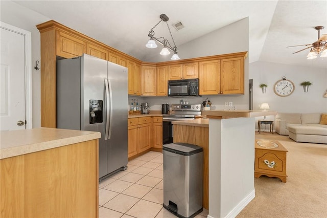 9336 Stonegate Dr, Omaha, AR 72662 - kitchen featuring appliances with stainless steel finishes, vaulted ceiling, ceiling fan, open floor plan, and light countertops