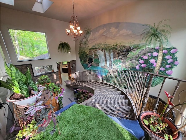 1655 Wilson Springs Rd, Harrison, AR 72601 - stairway featuring a chandelier and a skylight