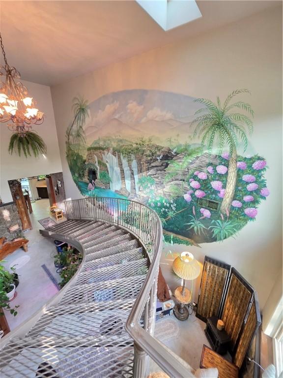 1655 Wilson Springs Rd, Harrison, AR 72601 - stairs with a chandelier and a skylight