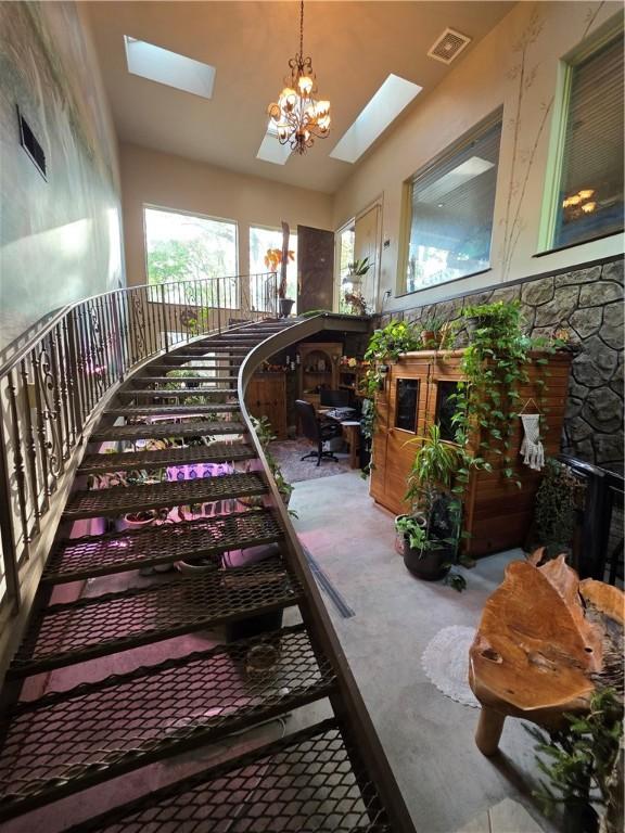 1655 Wilson Springs Rd, Harrison, AR 72601 - stairway featuring a skylight and carpet flooring