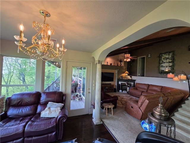 1655 Wilson Springs Rd, Harrison, AR 72601 - living area with arched walkways, beam ceiling, wood finished floors, a chandelier, and ceiling fan
