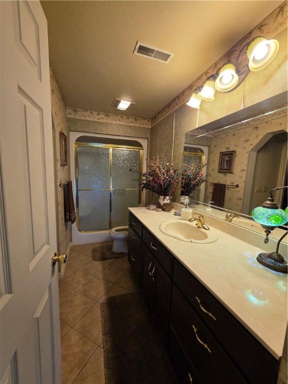 1655 Wilson Springs Rd, Harrison, AR 72601 - bathroom with wallpapered walls, a shower stall, tile patterned flooring, and vanity