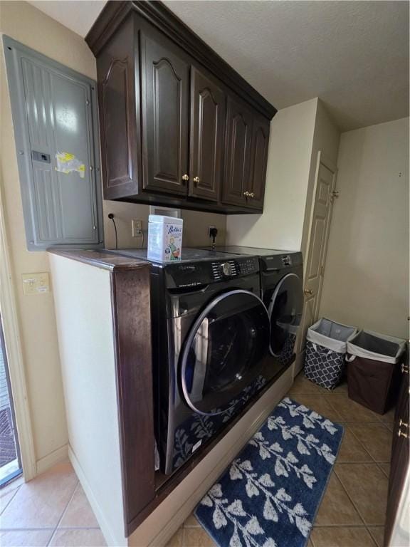 1655 Wilson Springs Rd, Harrison, AR 72601 - washroom featuring cabinet space, washing machine and clothes dryer, light tile patterned floors, and electric panel