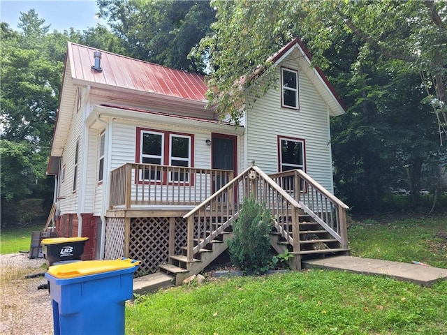 1112 Rush Ave, Harrison, AR 72601 - view of front of home featuring a front yard, a metal roof, and stairway