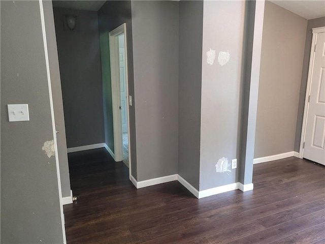 1112 Rush Ave, Harrison, AR 72601 - corridor featuring dark wood-style flooring and baseboards