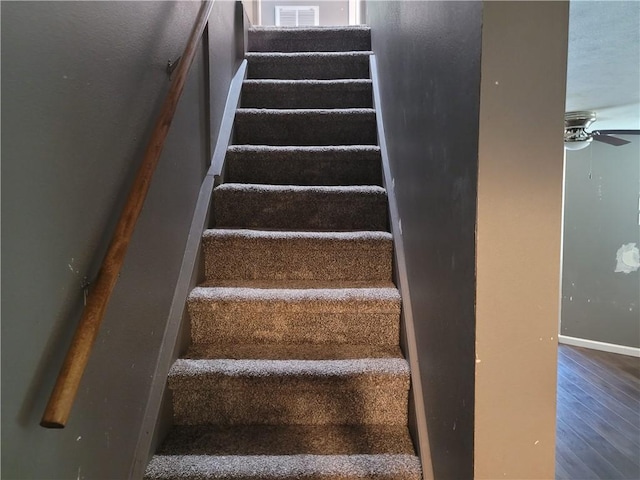 1112 Rush Ave, Harrison, AR 72601 - staircase featuring ceiling fan and wood finished floors
