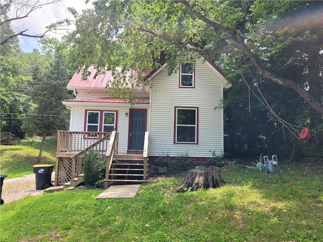 1112 Rush Ave, Harrison, AR 72601 - victorian house with a front lawn and a metal roof