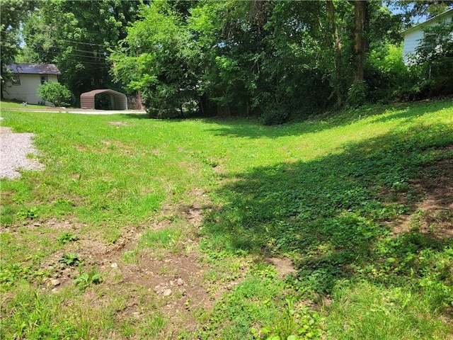 1112 Rush Ave, Harrison, AR 72601 - view of grassy yard with a carport