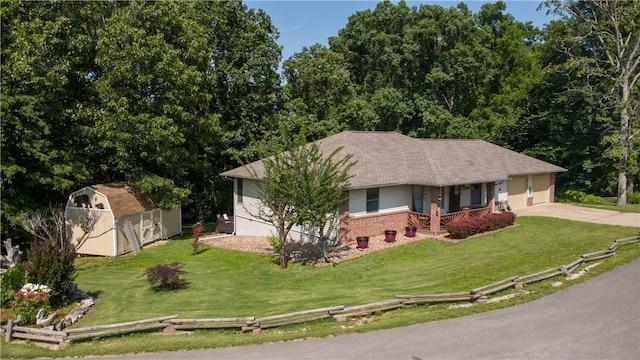 5 Coatbridge Ln, Bella Vista, AR 72715 - ranch-style home with a storage unit, a front lawn, a porch, brick siding, and concrete driveway