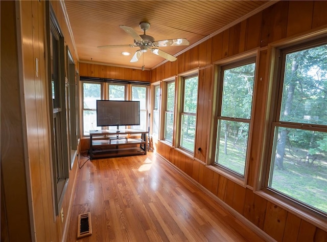 5 Coatbridge Ln, Bella Vista, AR 72715 - sunroom / solarium with healthy amount of natural light, wooden walls, ornamental molding, and wood finished floors