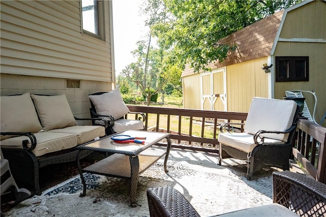 5 Coatbridge Ln, Bella Vista, AR 72715 - wooden terrace featuring an outdoor hangout area and a storage unit