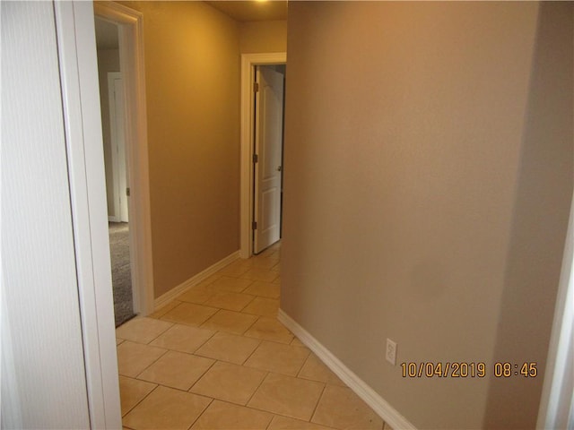 1110 Courage, Siloam Springs, AR 72761 - hall with light tile patterned floors and baseboards