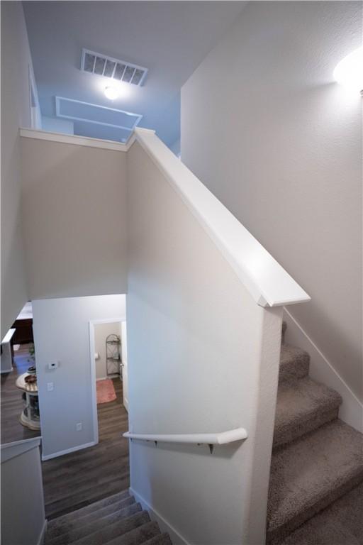 233 Evans St, Huntsville, AR 72740 - stairway with wood finished floors and baseboards