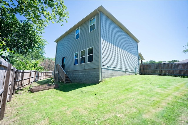 233 Evans St, Huntsville, AR 72740 - rear view of property featuring a fenced backyard and a garden