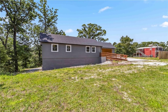 17707 12th Hwy, Rogers, AR 72756 - back of house featuring a wooden deck and a yard