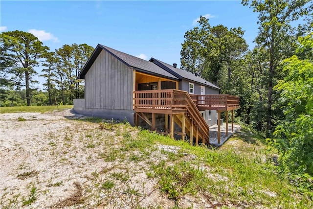 17707 12th Hwy, Rogers, AR 72756 - back of property featuring a wooden deck and stairway