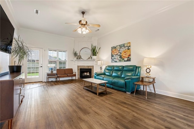 793 Buckhead Ave, Springdale, AR 72764 - living room featuring wood finished floors, ceiling fan, ornamental molding, and a lit fireplace