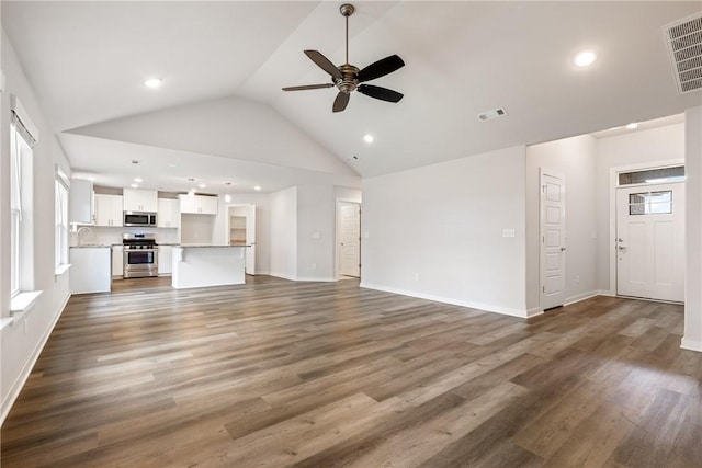 106 N Lion Dr, Gravette, AR 72736 - unfurnished living room featuring a ceiling fan, recessed lighting, dark wood-style floors, and high vaulted ceiling