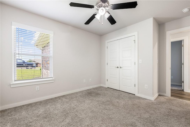 106 N Lion Dr, Gravette, AR 72736 - unfurnished bedroom featuring carpet floors, a closet, and a ceiling fan