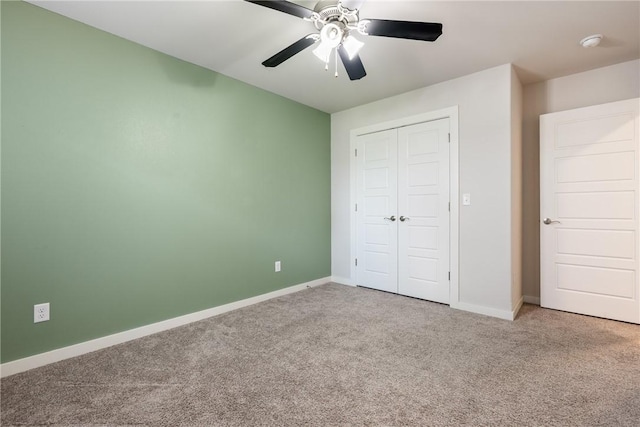 106 N Lion Dr, Gravette, AR 72736 - unfurnished bedroom featuring carpet flooring, a closet, and a ceiling fan