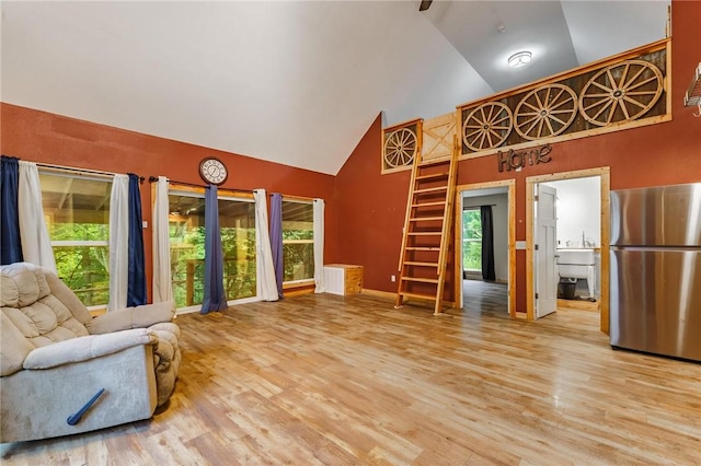 22006 Bozarth Cemetery Rd, Gentry, AR 72734 - living area featuring high vaulted ceiling and wood finished floors