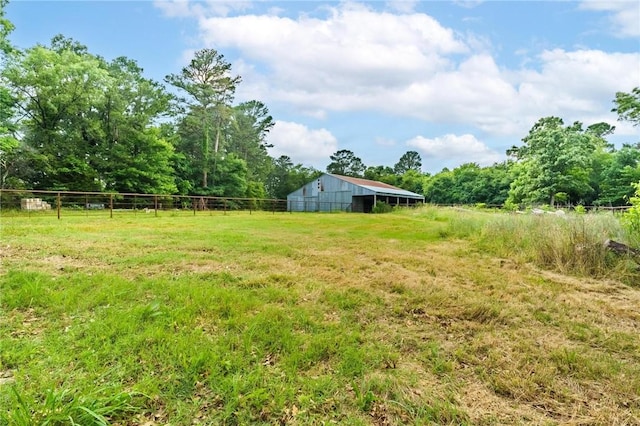 22006 Bozarth Cemetery Rd, Gentry, AR 72734 - view of yard featuring an outbuilding, an outdoor structure, a rural view, and a forest view