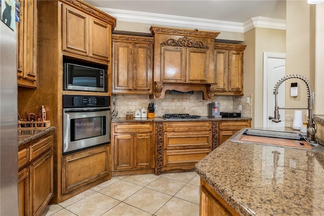 2301 SW Farringdon Ave, Bentonville, AR 72713 - kitchen with appliances with stainless steel finishes, brown cabinets, backsplash, crown molding, and light tile patterned floors
