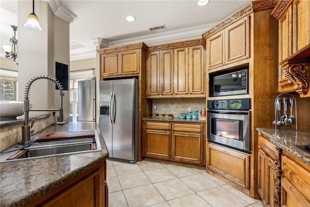 2301 SW Farringdon Ave, Bentonville, AR 72713 - kitchen featuring appliances with stainless steel finishes, brown cabinetry, decorative backsplash, crown molding, and light tile patterned floors