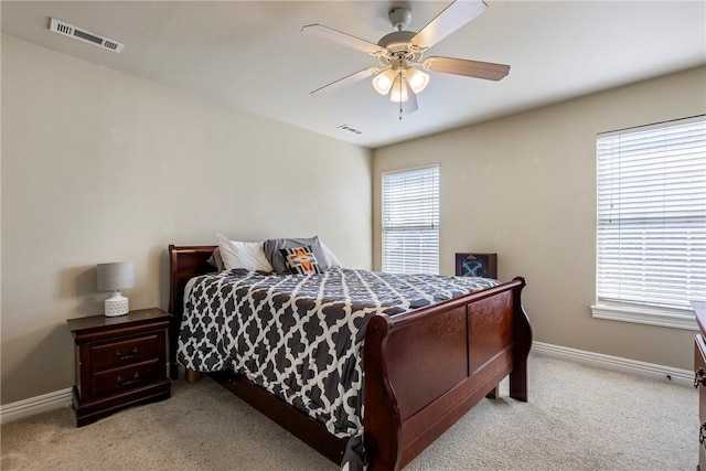 2301 SW Farringdon Ave, Bentonville, AR 72713 - carpeted bedroom with baseboards and ceiling fan