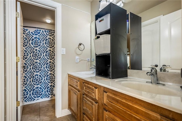2301 SW Farringdon Ave, Bentonville, AR 72713 - bathroom featuring double vanity, tile patterned floors, and a shower with shower curtain