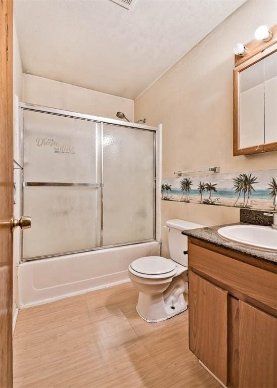 20724 E 578th Rd, Colcord, OK 74338 - bathroom featuring vanity, shower / bath combination with glass door, and wood finished floors