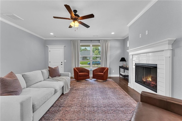 3205 Summer View Ave, Springdale, AR 72764 - living room with ceiling fan, ornamental molding, dark wood-type flooring, recessed lighting, and a tiled fireplace