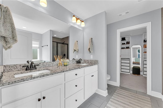 3205 Summer View Ave, Springdale, AR 72764 - full bath with a walk in closet, a stall shower, double vanity, and tile patterned flooring