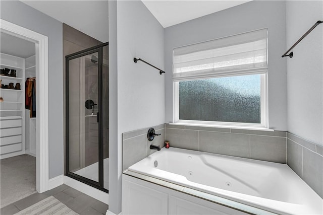 3205 Summer View Ave, Springdale, AR 72764 - full bathroom featuring a shower stall, a spacious closet, and a whirlpool tub