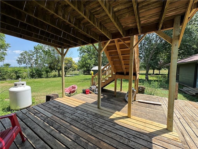 7792 Bubbling Springs Rd, Harrison, AR 72601 - wooden terrace with stairway, a lawn, and view of wooded area