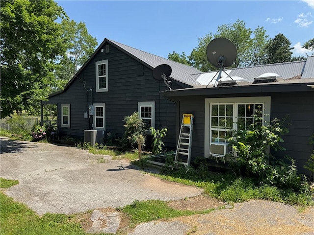 7792 Bubbling Springs Rd, Harrison, AR 72601 - back of house with a metal roof and cooling unit